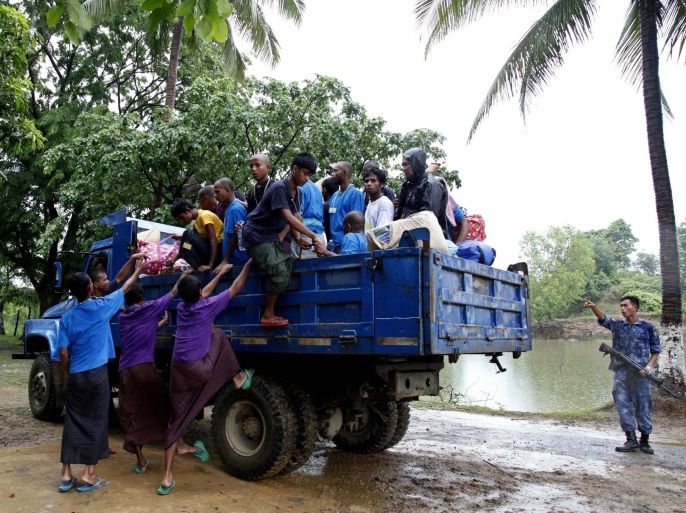 Migrants, who are to be repatriated from Myanmar to Bangladesh, climb up on the back of a truck at Taung Pyo temporary refugee camp, near the Bangladesh border, in MaungDaw township, Rakhine State, western Myanmar, 08 June 2015. Myanmar government announced that Myanmar's navy has seized a boat filled with 727 migrants, including 74 women and 45 children, near Irrawaddy delta of the country's southern coast as Asian countries on 29 May 2015, and it agreed at a Bangkok Meeting to collaborate in the region's recent migrant crisis issue. Myanmar planned to repatriate some 150 Bangladeshi Rohingya migrants from Myanmar to Bangladesh.