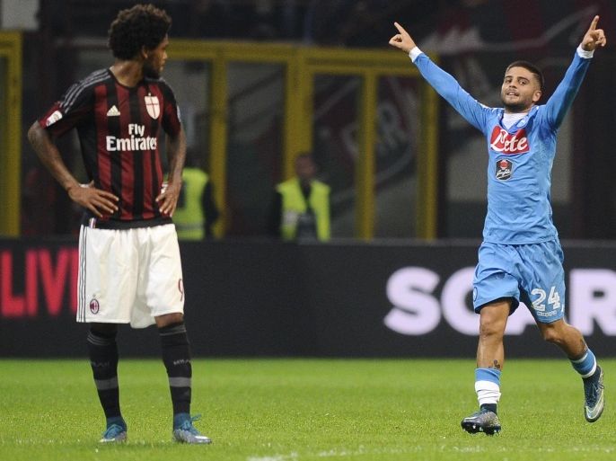 Napoli's Lorenzo Insigne (R) celebrates after scoring a goal as AC Milan's Luiz Adriano looks on during their Italian Serie A soccer match at the San Siro stadium in Milan, Italy, October 4, 2015. REUTERS/Giorgio Perottino