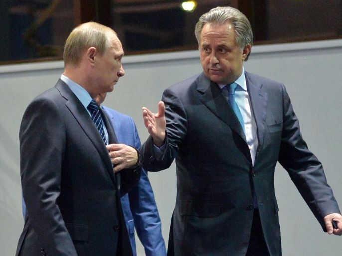 Russian President Vladimir Putin, left, and Sports Minister Vitaly Mutko, talk to each other during a visit to the federal government center "South Sports" before their late-night meeting with the heads of Russia's sports federations in the Black Sea resort of Sochi, Russia, Wednesday, Nov. 11, 2015. Putin has ordered an investigation into allegations of widespread doping among the country’s sports figures. (Alexei Druzhinin, RIA-Novosti, Kremlin Pool Photo via AP)