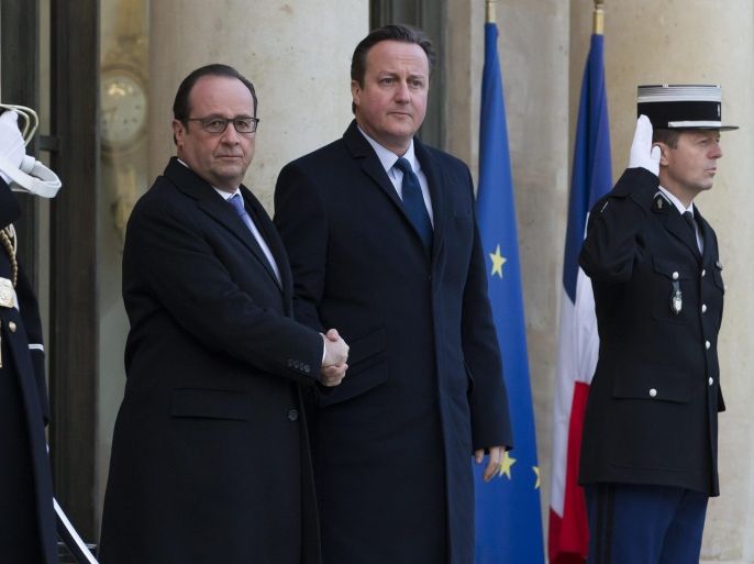 French president Francois Hollande (L) greets British Prime Minister David Cameron (R) as he arrives for a meeting at the Elysee Palace in Paris, France, 23 November 2015. Hollande and Cameron are meeting to discuss Britain's involvement in the coalition strikes against ISIS in Syria.