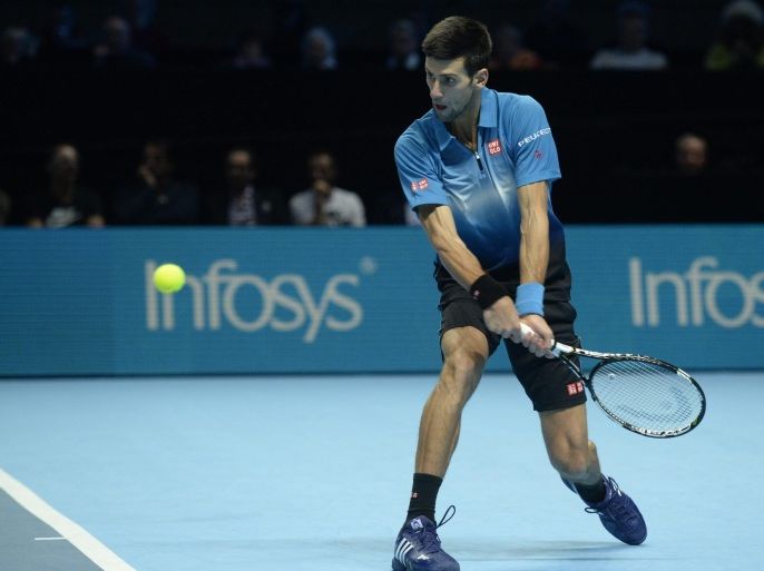 Serbia's Novak Djokovic in action against Spain's Rafael Nadal during their semi final match at the ATP Tour tennis finals tournament at the O2 Arena in London, Britain, 21 November 2015.