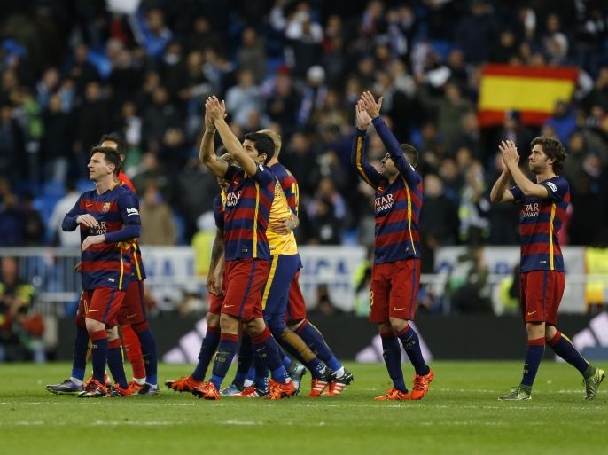 Barcelona's players celebrate their victory at the end of the first clasico of the season between Real Madrid and Barcelona at the Santiago Bernabeu stadium in Madrid, Spain, Saturday, Nov. 21, 2015. (AP Photo/Francisco Seco)