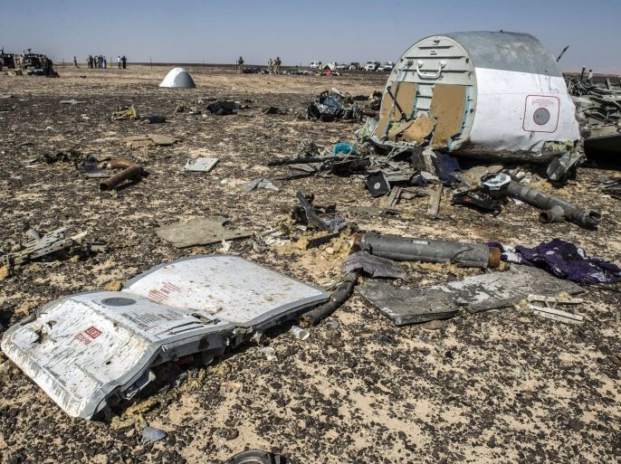Debris belonging to the A321 Russian airliner areseen at the site of the crash in Wadi el-Zolmat, a mountainous area in Egypt's Sinai Peninsula on November 1, 2015. International investigators began probing why a Russian airliner carrying 224 people crashed in Egypt's Sinai Peninsula, killing everyone on board, as rescue workers widened their search for missing victims. AFP PHOTO / KHALED DESOUKI
