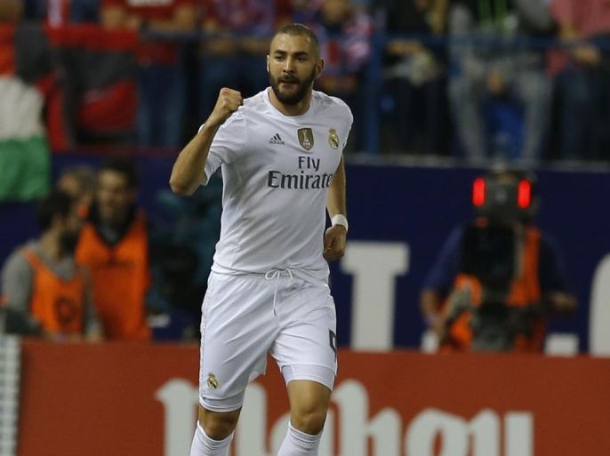 Real Madrid's Karim Benzema celebrates after scoring the opening goal against Atletico Madrid during a Spanish La Liga soccer match between Real Madrid and Atletico Madrid at the Vicente Calderon stadium in Madrid, Sunday, Oct. 4, 2015. (AP Photo/Francisco Seco)