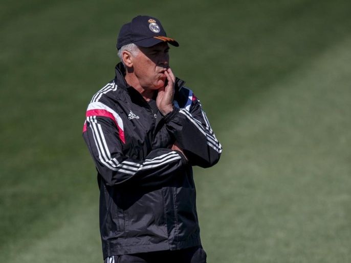 Real Madrid coach Carlo Ancelotti reacts during a training session at Valdebebas, outside Madrid, Spain, May 22, 2015. If there is one lesson Ancelotti has learned during his two seasons in Spain it is that resting on your laurels is not an option at the world's richest club by income. After leading Real to a record-extending 10th European crown and a King's Cup triumph last term, Real have failed to win any of the three major trophies in 2014-15 and speculation has already been swirling for weeks about the Italian's future. Club director Emilio Butragueno pointedly refused to confirm Ancelotti will see out his contract, which runs for another season, after Real were knocked out of the Champions League by Juventus on Wednesday. REUTERS/Andrea Comas