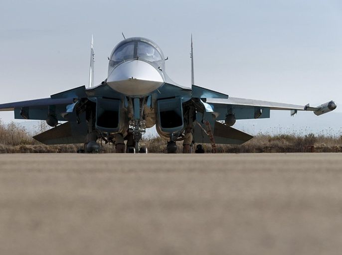 Russian ground staff members work on a Sukhoi Su-34 fighter jet at the Hmeymim air base near Latakia, Syria, in this handout photograph released by Russia's Defence Ministry October 22, 2015. REUTERS/Ministry of Defence of the Russian Federation/Handout via Reuters ATTENTION EDITORS - THIS PICTURE WAS PROVIDED BY A THIRD PARTY. REUTERS IS UNABLE TO INDEPENDENTLY VERIFY THE AUTHENTICITY, CONTENT, LOCATION OR DATE OF THIS IMAGE. EDITORIAL USE ONLY. NOT FOR SALE FOR MARKETING OR ADVERTISING CAMPAIGNS. NO RESALES. NO ARCHIVE. THIS PICTURE IS DISTRIBUTED EXACTLY AS RECEIVED BY REUTERS, AS A SERVICE TO CLIENTS