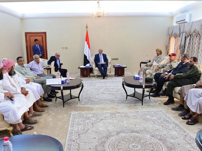 In this photo provided by the Yemeni Presidency, Yemeni President Abed Rabbo Mansour Hadi, center, meets with officials and local leaders in the southern port city of Aden, Yemen, Sunday, Dec. 13, 2015. Yemen's internationally recognized government and Shiite rebels who have controlled the capital Sanaa since September last year agreed Saturday to start a weeklong ceasefire on the eve of direct talks in Geneva, both sides confirmed. (AP Photo/Yemeni Presidency)