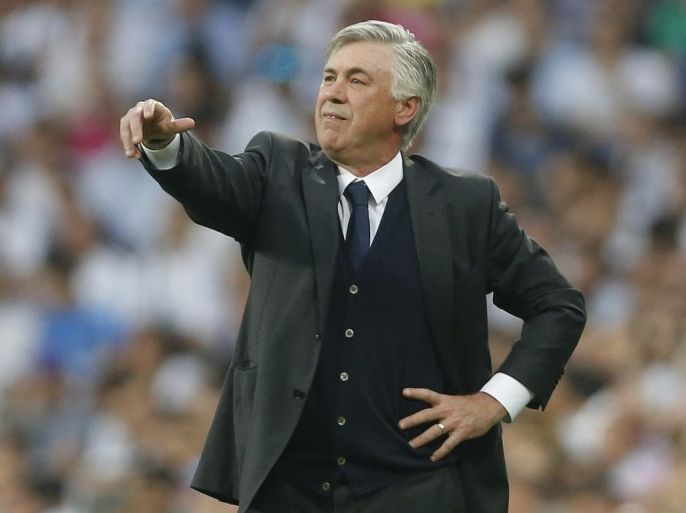 FILE - In this May 13, 2015, file photo, Real Madrid's coach Carlo Ancelotti gives directions to his players during the Champions League second leg semifinal soccer match between Real Madrid and Juventus, at the Santiago Bernabeu stadium in Madrid. Real Madrid has fired coach Carlo Ancelotti, one season after he led the club to its 10th European Cup title. Club president Florentino Perez said Monday, May 25, 2015, that Ancelotti's successor would be announced next week. (AP Photo/Daniel Ochoa de Olza, File)