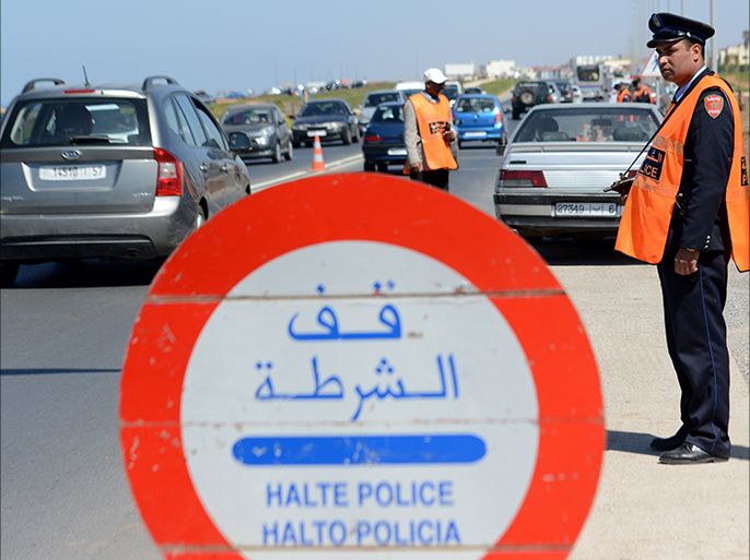 epa04128404 Moroccan police officers man a checkpoint at one of the entrances to the city of Rabat, Morocco, 16 March 2014. Spanish Interior Ministry said on 14 March that security forces in Spain and Morocco arrested seven accused members of an Islamist cell recruiting fighters to send to conflict regions, including Syria and Mali. Four people were arrested in southern Spain and three were arrested in Morocco during a joint operation between the countries' police forces. EPA