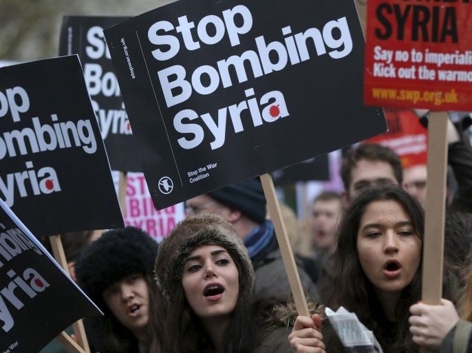 Protestors in London, Britain December 12, 2015 take part in a demonstration against bombing Syria. REUTERS/Neil Hall