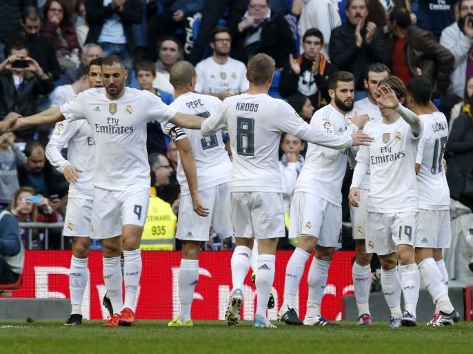 Real Madrid's players jubilate the third goal of the team scored by Welsh midfielder Gareth Bale against Getafe FC during their Primera Division soccer match played at Santiago Bernabeu stadium in Madrid, Spain on 05 December 2015.