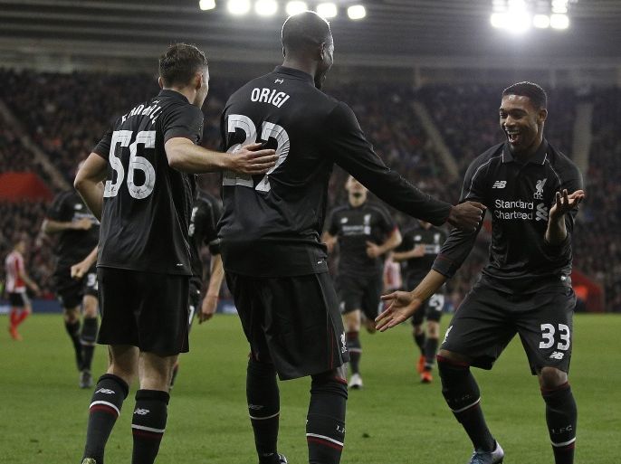 Liverpool's Belgian striker Daniel Origi (C) celebrates scoring his team's fourth goal with Liverpool's English midfielder Jordon Ibe (R) during the English League Cup quarter-final football match between Southampton and Liverpool at St Mary's Stadium in Southampton, southern England on December 2, 2015. AFP PHOTO / ADRIAN DENNIS