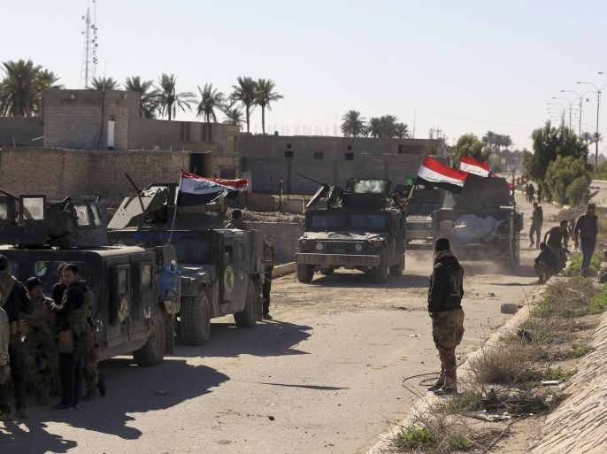 Iraqi security forces deploy in the Soufiya neighborhood in central Ramadi, 70 miles (115 kilometers) west of Baghdad, Iraq, Thursday, Jan. 14, 2016. More than two weeks after central Ramadi was declared liberated, Iraq's counter terrorism forces are slowly battling pockets of Islamic State militants on the northeastern edges. Commanders on the ground say roadside bombs, bobby-trapped houses and the militant group's use of civilians as human shields are the main factors slowing their progress. . (AP Photo/Khalid Mohammed)