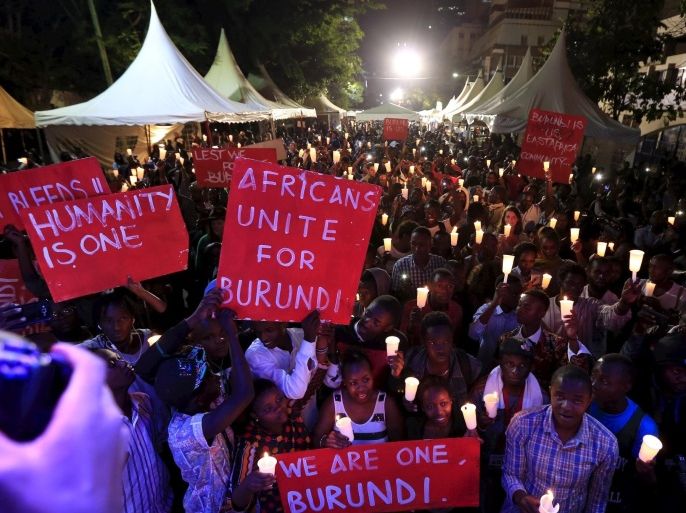 People light candles during a street concert organized to highlight the situation in Burundi by PAWA254, an activist organization, in Kenya's capital Nairobi December 20, 2015. REUTERS/Noor Khamis