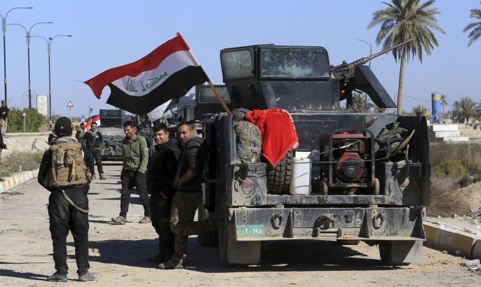 Iraqi security forces deploy in the Soufiya neighborhood in central Ramadi, 70 miles (115 kilometers) west of Baghdad, Iraq, Thursday, Jan. 14, 2016. More than two weeks after central Ramadi was declared liberated, Iraq's counter terrorism forces are slowly battling pockets of Islamic State militants on the northeastern edges. Commanders on the ground say roadside bombs, bobby-trapped houses and the militant group's use of civilians as human shields are the main factors slowing their progress. (AP Photo/Khalid Mohammed)