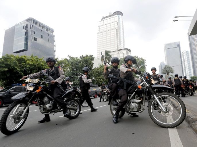 Members of the Indonesian police ride motorbikes as they patrol after a bomb blast in front of a shopping mall in Jakarta, Indonesia, 14 January 2016. Explosions near a shopping centre in the Indonesian capital Jakarta killed at least three people on Thursday, television reports and witnesses said. Police exchanged fire with suspected attackers after the blasts at a traffic police post in front of the Sarinah shopping centre and a nearby Starbucks coffee shop, media reported.