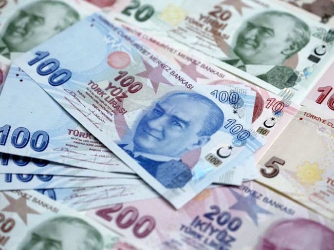 Turkish lira banknotes are seen in this file photo illustration shot in Istanbul, Turkey January 7, 2014. Turkeyâ€™s central bank is expected to make an interest rate decision this week. REUTERS/Murad Sezer/FilesGLOBAL BUSINESS WEEK AHEAD PACKAGE - SEARCH "BUSINESS WEEK AHEAD NOVEMBER 23" FOR ALL IMAGES
