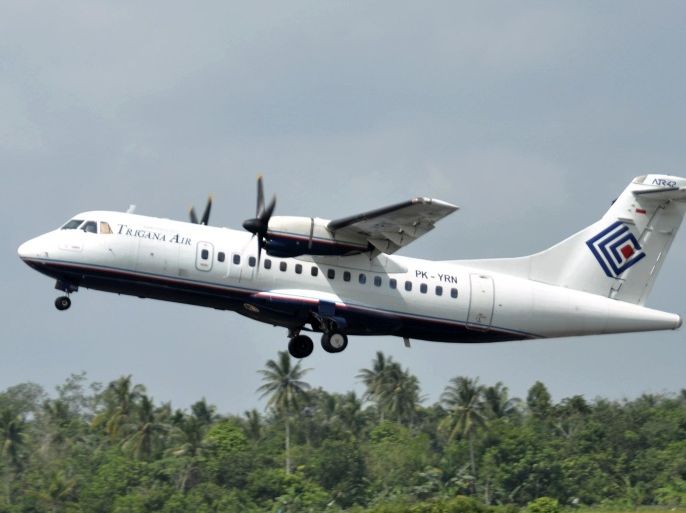 In this photo taken Dec. 26, 2010, Trigana Air Service's ATR42-300 twin turboprop plane takes off at Supadio airport in Pontianak, West Kalimantan, Indonesia. The same type of a Trigana airliner carrying 54 people was missing Sunday, Aug. 16, 2015 after losing contact with ground control during a short flight in bad weather in the country's mountainous easternmost province of Papua, officials said. A search for the plane was suspended and will resume Monday morning. (AP Photo)