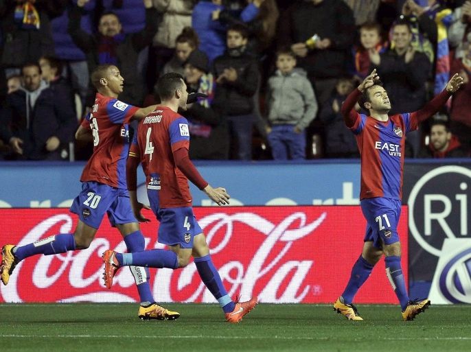 UD Levante's Italian striker Giuseppe Rossi (R) celebrates with his teammates after scoring the 2-0 lead against Getafe CF during their Spanish Liga Primera Division soccer match played at Ciutat de Valencia stadium, in Valencia, eastern Spain, 19 February 2016.