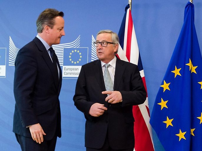British Prime Minister David Cameron, left, is greeted by European Commission President Jean-Claude Juncker at EU headquarters in Brussels on Tuesday, Feb. 16, 2016. David Cameron is visiting EU leaders two days ahead of a crucial EU summit. (AP Photo/Geert Vanden Wijngaert)