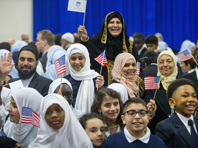 Children from Al-Rahmah school and other guests react after seeing President Barack Obama during his visit to the Islamic Society of Baltimore, Wednesday, Feb. 3, 2016, in Baltimore, Md. Obama is making his first visit to a U.S. mosque at a time Muslim-Americans say they're confronting increasing levels of bias in speech and deeds.(AP Photo/Pablo Martinez Monsivais)