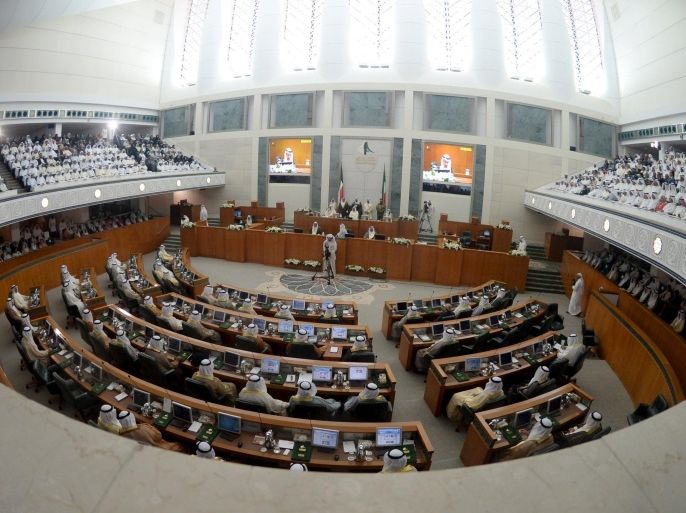 Members of parliament sit in the Parliament pit during the opening session of the fourth year of the 14th Parliament in Kuwait City, Kuwait, October 27, 2015. The emir of Kuwait urged the cabinet and parliament on Tuesday to cut state spending in response to slumping oil prices, warning that any delay would increase the damage to the government's finances. The remarks by Sheikh Sabah al-Ahmed al-Sabah, in a speech to parliament, appeared to be an effort to prepare the ground for politically difficult economy measures such as cuts in energy and food price subsidies, which could occur next year. REUTERS/Stringer EDITORIAL USE ONLY. NO RESALES. NO ARCHIVE