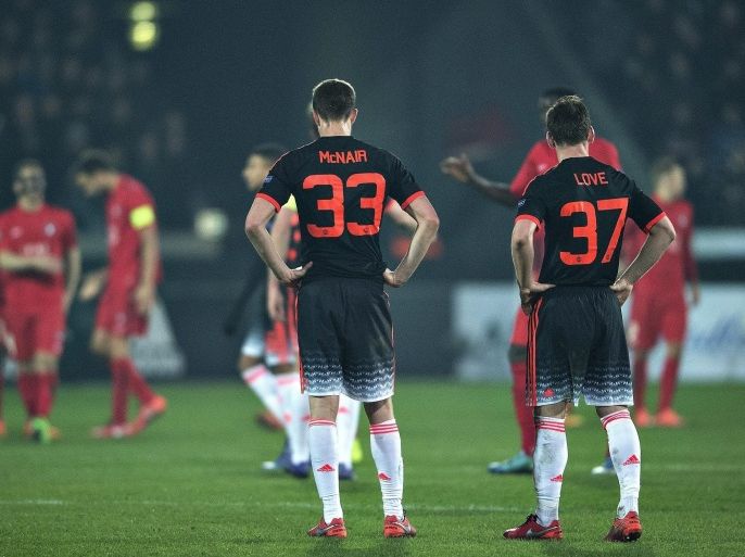 Manchester United's Paddy McNair (C) and Donald Love (R) react after losing the UEFA Europa League soccer match between FC Midtjylland and Manchester United in Herning, Denmark, 18 February 2016. EPA/HENNING BAGGER DENMARK OUT