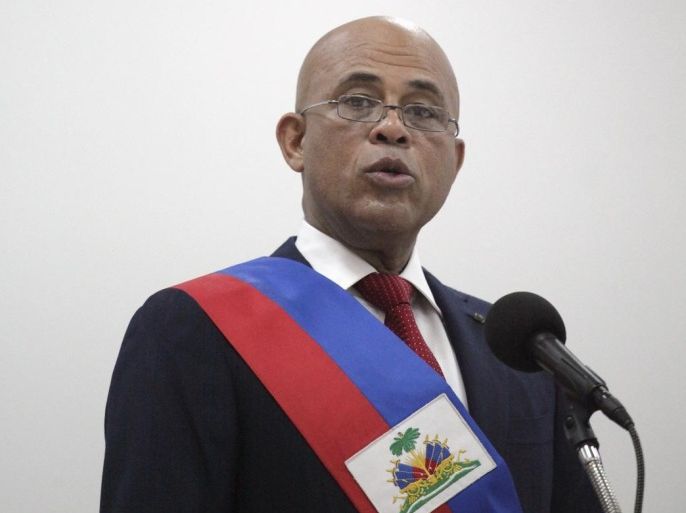 Haiti's outgoing President Michel Martelly speaks during his speech at a ceremony marking the end of his presidential term, in the Haitian Parliament in Port-au-Prince, Haiti, February 7, 2016. REUTERS/Andres Martinez Casares