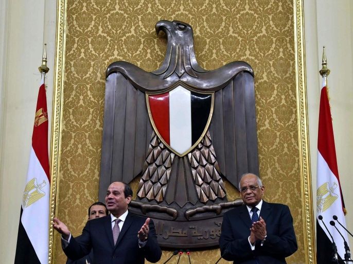 A handout photograph made available by the Egyptian Presidency shows Egyptian President Abdel Fattah al-Sisi (L) being greeted by lawmakers as Speaker of the Egyptian Parliament Ali Abdel-Al (R) looks on at the Parliament, in Cairo, Egypt, 13 February 2016. Al-Sisi on 13 February delivered his first speech in front of the newly convened parliament. The 569-member assembly met for its inaugural session on 10 January 2016. EPA/EGYPTIAN PRESIDENCY/HANDOUT