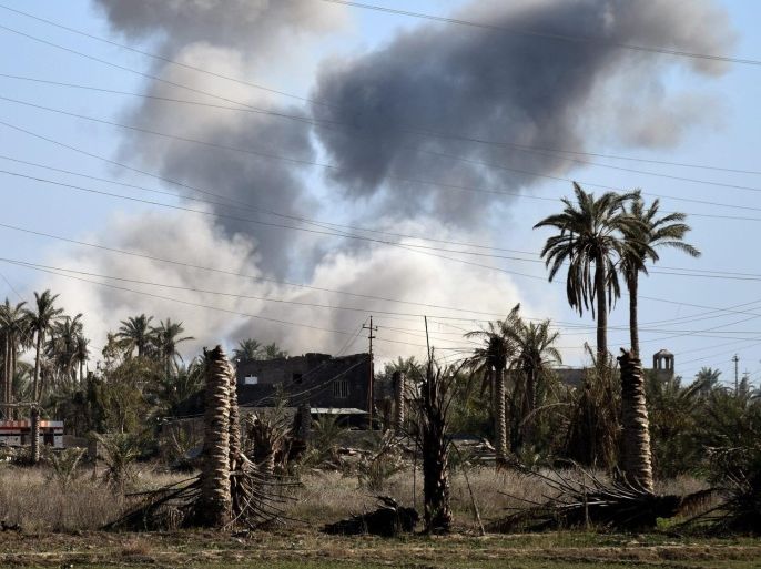A picture made available on 05 February 2016, shows smoke rising during fighting between Iraqi army and Islamic State (IS) militants in Ramadi city, western Iraq, on 04 February 2016. Media reports state that at least 22 Iraqi soldiers were killed in a triple suicide attack on a military base west of Ramadi, the capital of turbulent Anbar province. Suicide bombers blow themselves up inside Ayn Al Asad air base western Ramadi ciry, a military official said. In December 2015, the Iraqi government announced the 'liberation' of Ramadi from Islamic State, marking the first major setback for the al-Qaeda breakaway group since April.