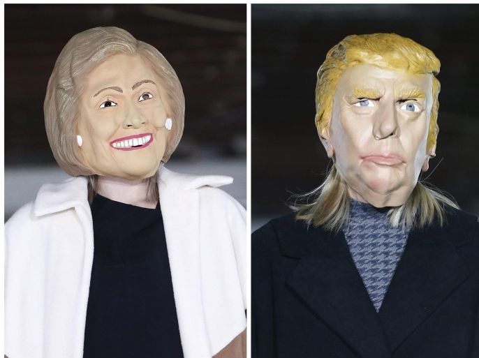 A composite combo photo shows models wearing masks bearing a likeness to US presidential candidates Hillary Clinton (L) and Donald Trump (R), as they present creations during the Fall/Winter 2016/17 Men's collection by AVOC fashion house during the Paris Fashion Week, in Paris, France, 20 January 2016. The presentation of the Men's collections run from 20 to 24 January. EPA/IAN LANGSDON COMBO PHOTO