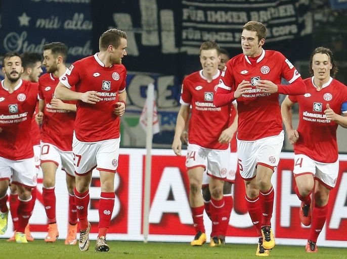 Mainz's players celebrate their side's opening goal during a German Bundesliga soccer match between FSV Mainz 05 and FC Schalke 04 in Mainz, Germany, Friday, Feb. 12, 2016. (AP Photo/Michael Probst)