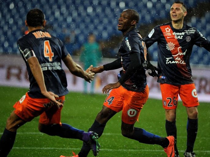 ST2337 - Montpellier, Hérault, FRANCE : Montpellier's French midfielder Bryan Dabo (C) celebrates with teammates after scoring a goal during the French L1 football match between Montpellier and Lille at the Mosson stadium in Montpellier, southern France, on February 27, 2016. AFP PHOTO / SYLVAIN THOMAS