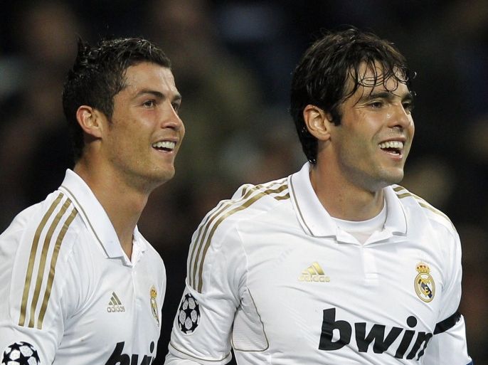 File - In this April 4, 2012 file photo, Real Madrid's Cristiano Ronaldo from Portugal, left, celebrates scoring a goal with team mate Kaka from Brazil during a soccer match at the Santiago Bernabeu stadium, in Madrid. Real Madrid fans were left bewildered by Ronaldo's admission of feeling "sad" after a two-goal performance on Sunday. Aug. 2, 2012. The Portugal forward called it a "professional" problem that the club is aware of. Kaka, who hasn't played a single minute this season, insisted he was happy at the club and called this season's challenges "a new chapter" representing a psychological test of his patience. (AP Photo/Daniel Ochoa de Olza, File)