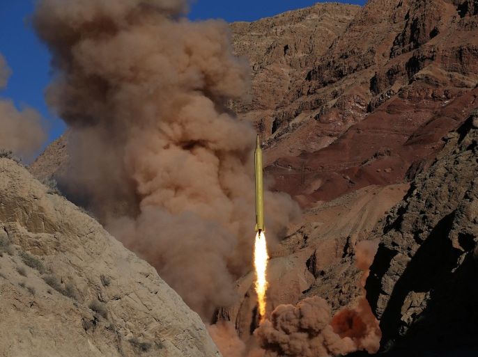 FILE -- In this Wednesday, March 9, 2016 file photo obtained from the Iranian Fars News Agency, a Qadr H long-range ballistic surface-to-surface missile is fired by Iran's powerful Revolutionary Guard, during a maneuver, in an undisclosed location in Iran. On Sunday, March 13, 2016 Israeli Prime Minister Benjamin Netanyahu called on world powers to punish Iran after the country test-fired two ballistic missiles emblazoned with the phrase “Israel must be wiped out” in Hebrew. (AP Photo/Fars News Agency, Omid Vahabzadeh)