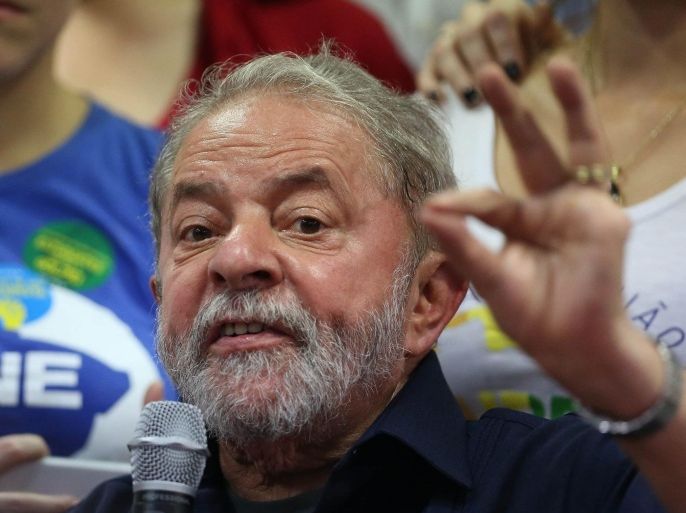 (FILE) A file picture rdated 04 March 2016 shows Brazilian former President Luiz Inacio Lula da Silva during a press conference in Sao Paulo, Brazil. Prosecutors in Sao Paulo filed charges on 10 March 2016 against former President Luiz Inacio Lula da Silva in connection with a corruption scheme centered on Brazil's state-controlled oil company, Petrobras. On 03 March, police acting on orders from federal prosecutors in Parana state raided Lula's home outside Sao Paulo and detained him for questioning for several hours. In the complaint presented on 10 March, Sao Paulo prosecutors accused Lula, who remains a towering figure in Brazilian politics, of hiding the fact that he is the owner of a luxury beachfront apartment that is listed in the name of the OAS construction firm, one of those being investigated in the Petrobras case. The former president, who governed from 2003 through 2010, vehemently denies any wrongdoing.