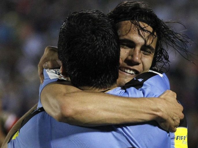 Edinson Cavani (R) of Uruguay celebrates his goal against Peru with his teammate Luis Suarez (L) during the FIFA World Cup 2018 Qualification soccer match between Uruguay and Peru at the Centenario Stadium in Montevideo, Uruguay, 29 March 2016.