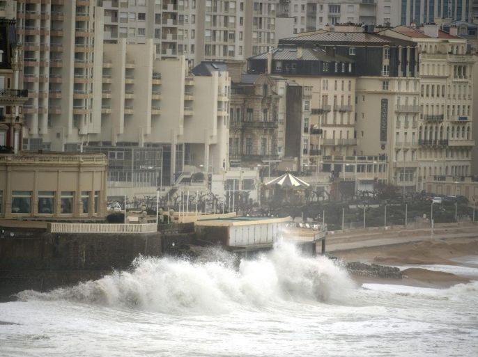 Huge waves propelled by gale force winds roll towards the beach of Biarritz, as strong winds hit the south-west region of France, 10 February 2016. Media reports state that 'orange' weather warnings have been issued by the authorities of several departements.