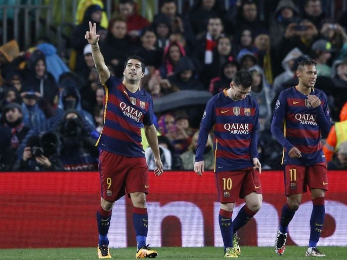 Barcelona's Luis Suarez, left, celebrates after scoring his side's second goal with Barcelona's Lionel Messi, center, and Barcelona's Neymar, right, during the Champions League round of 16 second leg soccer match between FC Barcelona and Arsenal FC at the Camp Nou stadium in Barcelona, Spain, Wednesday, March 16, 2016. (AP Photo/Manu Fernandez)