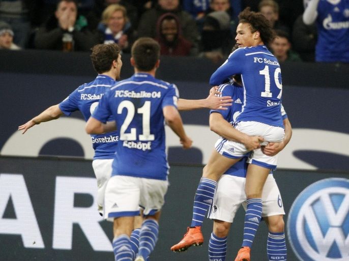 Schalke's Leroy Sane (R) celebrates the 1-0 lead with Alessandro Schoepf (C) and Leon Goretzka during the German Bundesliga match between Schalke and Moenchengladbach in Gelsenkirchen, Germany, 18 March 2016. EPA/ROLAND WEIHRAUCH (EMBARGO CONDITIONS - ATTENTION: Due to the accreditation guidelines, the DFL only permits the publication and utilisation of up to 15 pictures per match on the internet and in online media during the match.)