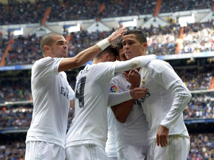 Real Madrid's Portuguese striker Cristiano Ronaldo (R) jubilates his first goal against Celta Vigo during their Primera Division soccer match played at Santiago Bernabeu stadium in Madrid, Spain on 05 March 2016.