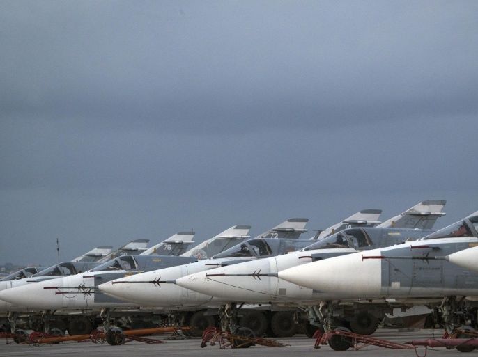 Russian bombers are parked at Hemeimeem air base in Syria, Friday, March 4, 2016. Russian warplanes have mostly stayed on the ground since the Russian- and U.S.-brokered cease-fire has begun last weekend. (AP Photo/Pavel Golovkin)
