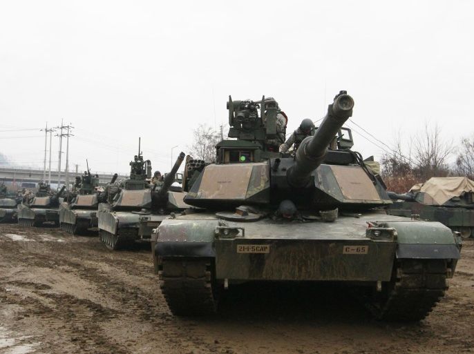 U.S. M1A2 SEP Abrams battle tanks prepare to cross the Hantan river during a river crossing operation, part of an annual joint military exercise between South Korea and the United States against a possible attack from North Korea, in Yeoncheon, south of the demilitarized zone that divides the two Koreas, South Korea, Thursday, Dec. 10, 2015. It was the last day of the exercise by the two allies that began on Dec. 1. (AP Photo/Ahn Young-joon)