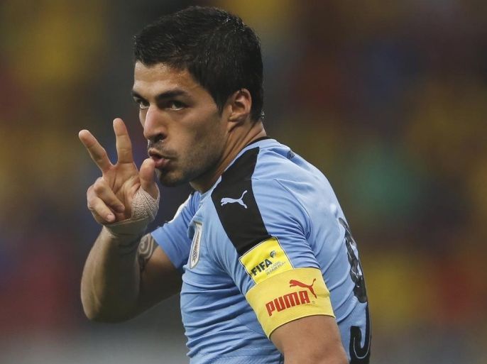 Uruguay's Luis Suarez celebrates after scoring against Brazil during a 2018 World Cup qualifying soccer match at the Pernambuco Arena, in Recife, Brazil, Friday, March 25, 2016. (AP Photo/Leo Correa)