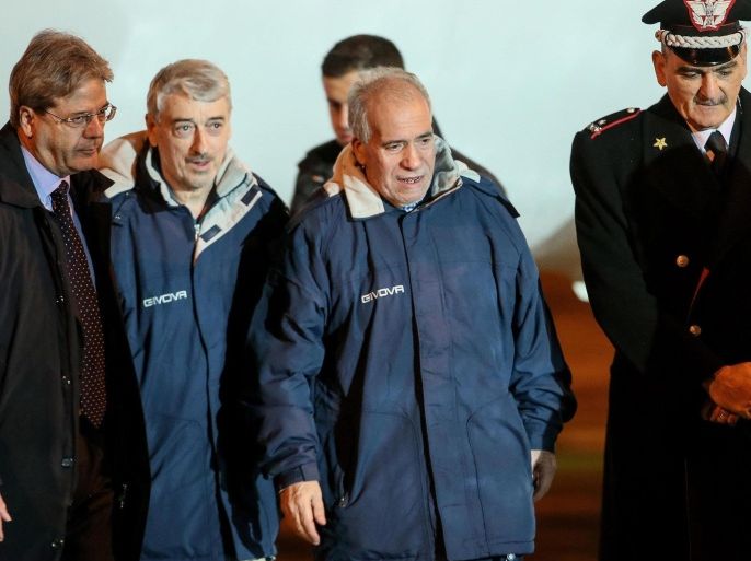 Italian Foreign Minister Paolo Gentiloni (L) welcomes Gino Pollicardo (C) and Filippo Calcagno (2-R) as they they arrive at Ciampino Rome airport from Libya in Ciampino, Italy, 05 March 2016. The hostages were freed in a raid on Islamic State (IS) group hideouts in a city near the capital, officials in Libya reported. Calcagno and Pollicardo went missing on July 19 along with Fausto Piano and Salvatore Failla, who were killed in a shootout in Sabratha province. All four were working in Libya for Italian oil and gas engineering firm Bonatti. Europe and the United States are increasingly concerned about the expansion of the Islamic State terrorist group in Libya, which has been in chaos since the 2011 NATO-backed ouster of long-time dictator Moamer Gaddafi, and are considering a military response to the threat.