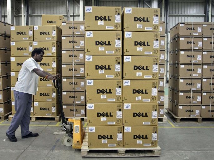 A man pushes a trolley full of Dell computers through a company factory in Sriperumbudur Taluk, in the Kancheepuram district of the southern Indian state of Tamil Nadu, in this June 2, 2011 file photograph. Personal computer sales plunged 14 percent in the first three months of the year, the biggest decline in two decades of keeping records, as tablets continue to gain in popularity and buyers appear to be avoiding Microsoft Corp's new Windows 8 system, according to a leading tech tracking firm. REUTERS/Babu/Files (INDIABUSINESS - Tags: BUSINESS INDUSTRIAL)