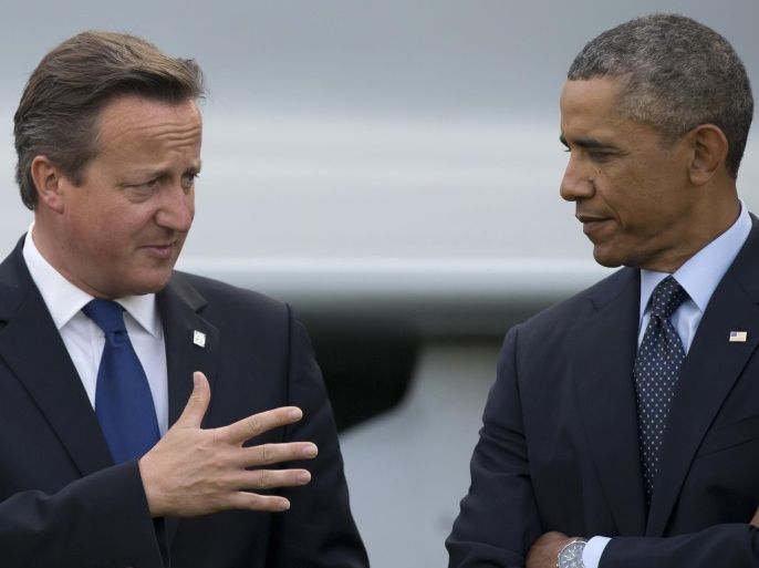 FILE - This is a Friday, Sept. 5, 2014 file photo of U.S. President Barack Obama, right, as he speaks with British Prime Minister David Cameron during a flypast at the NATO summit at the Celtic Manor Resort in Newport, Wales. The British press on Friday March 11, 2016 has accused President Obama of launching a verbal attack on Prime Minister David Cameron. Obama's comments in a magazine interview were called 'unprecedented' and 'extraordinary.' The hubbub has pushed the White House into damage control mode and US officials issued a statement asserting close ties between the leaders. (AP Photo/Jon Super, File)
