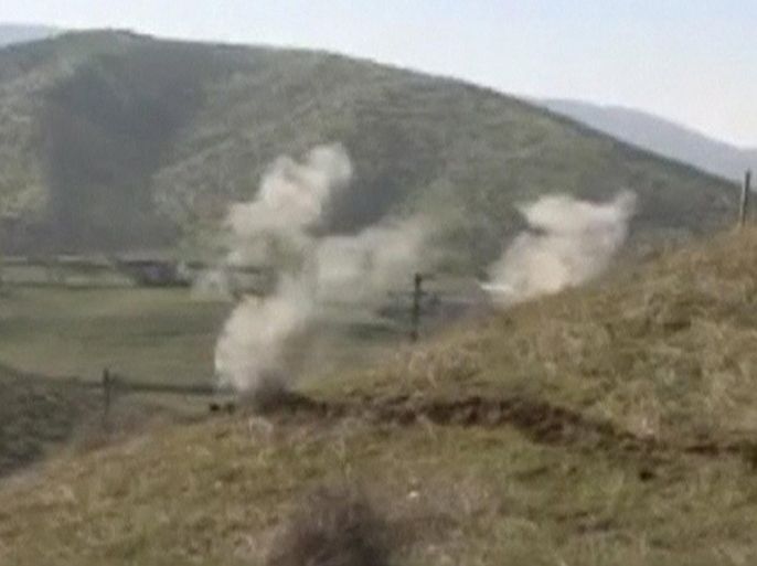 Smoke rises after clashes between Armenian and Azeri forces in Nagorno-Karabakh region, which is controlled by separatist Armenians, in this still image taken from video provided by the Nagorno-Karabakh region Defence Ministry April 2, 2016. REUTERS/Nagorno-Karabakh Military Handout via Reuters TV ATTENTION EDITORS - THIS PICTURE WAS PROVIDED BY A THIRD PARTY. REUTERS IS UNABLE TO INDEPENDENTLY VERIFY THE AUTHENTICITY, CONTENT, LOCATION OR DATE OF THIS IMAGE. EDITORIAL USE ONLY. NOT FOR SALE FOR MARKETING OR ADVERTISING CAMPAIGNS. NO RESALES. NO ARCHIVE. THIS PICTURE IS DISTRIBUTED EXACTLY AS RECEIVED BY REUTERS, AS A SERVICE TO CLIENTS.
