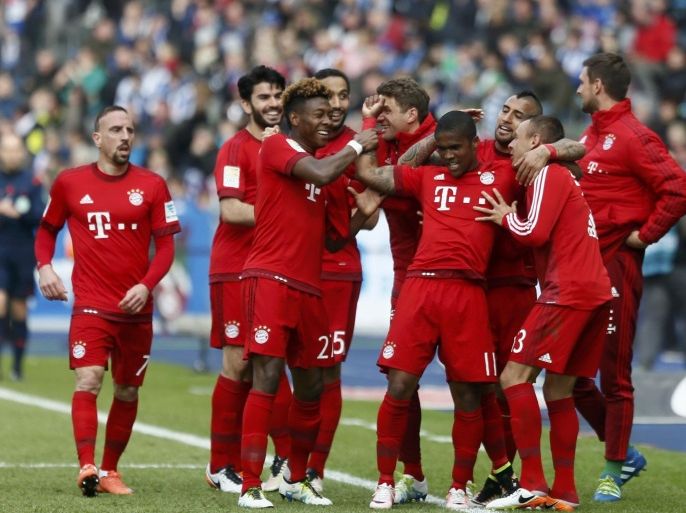 Football Soccer - Hertha BSC v Bayern Munich - German Bundesliga - Olympiastadion, Berlin, Germany - 23/04/16 Bayern Munich's team players celebrate scoring a goal. REUTERS/Hannibal Hanschke DFL RULES TO LIMIT THE ONLINE USAGE DURING MATCH TIME TO 15 PICTURES PER GAME. IMAGE SEQUENCES TO SIMULATE VIDEO IS NOT ALLOWED AT ANY TIME. FOR FURTHER QUERIES PLEASE CONTACT DFL DIRECTLY AT + 49 69 650050.