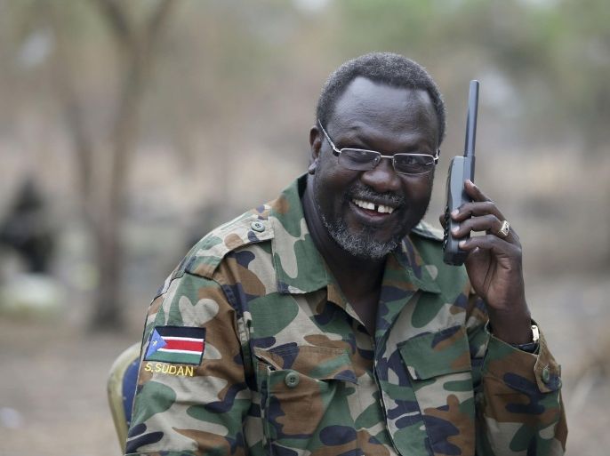 Riek Machar, South Sudan's then rebel leader, talks on the phone in his field office in a rebel-controlled territory in Jonglei State, South Sudan, in this February 1, 2014 file photo. REUTERS/Goran Tomasevic/Files TPX IMAGES OF THE DAY